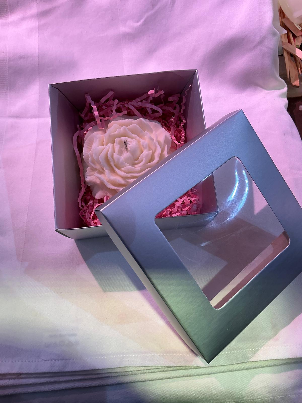 Vela rosa blanca en caja