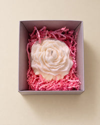 Vela rosa blanca en caja